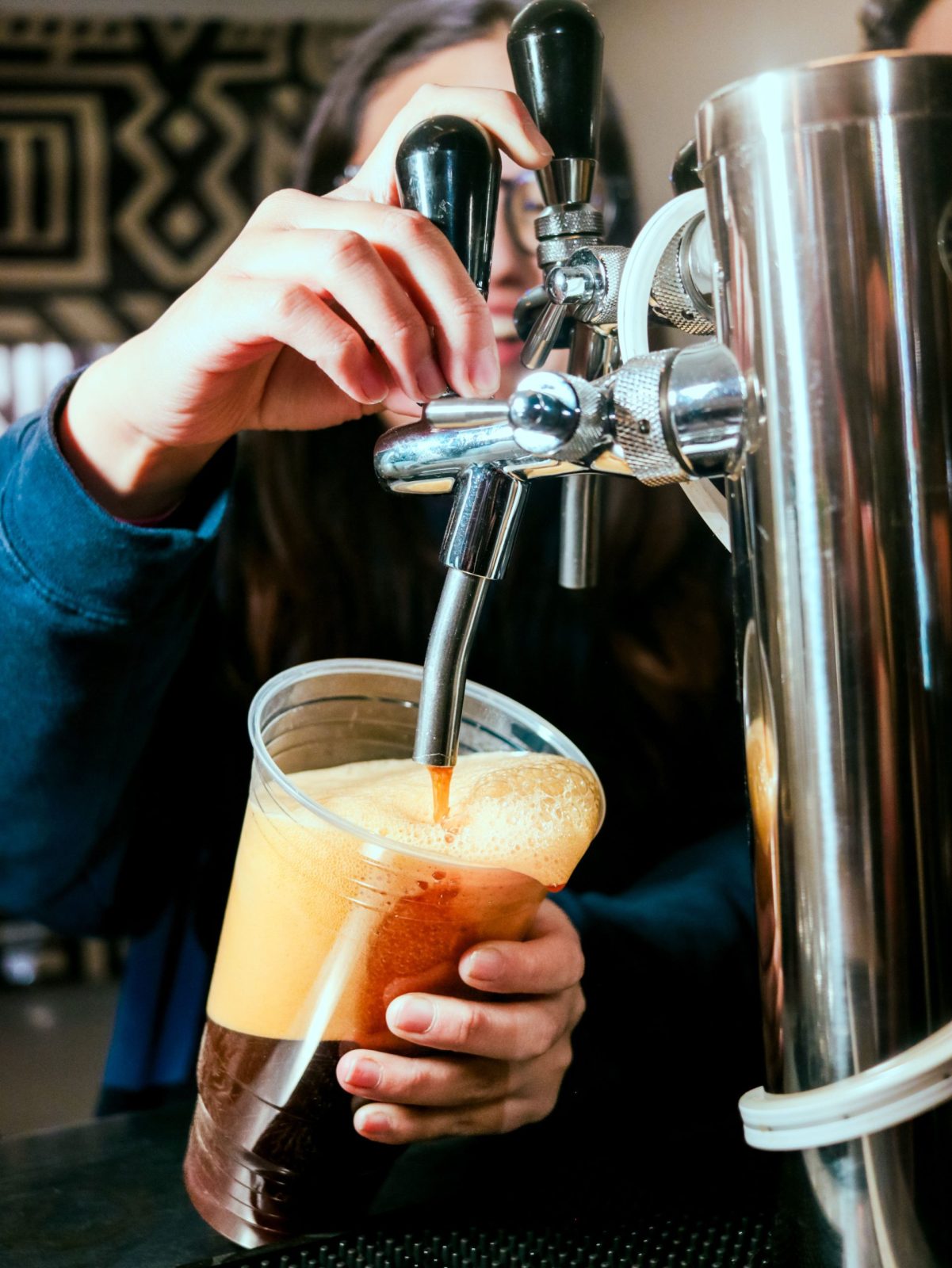 Milk pouring into iced coffee